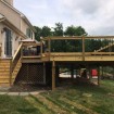 Rabolt Wood Deck with Black Balusters and Solar Caps