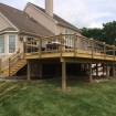 Rabolt Wood Deck with Black Balusters and Solar Caps