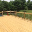 Rabolt Wood Deck with Black Balusters and Solar Caps