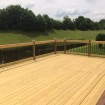 Rabolt Wood Deck with Black Balusters and Solar Caps